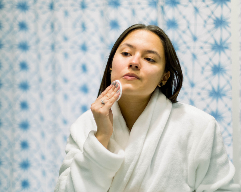 Latin woman washing face