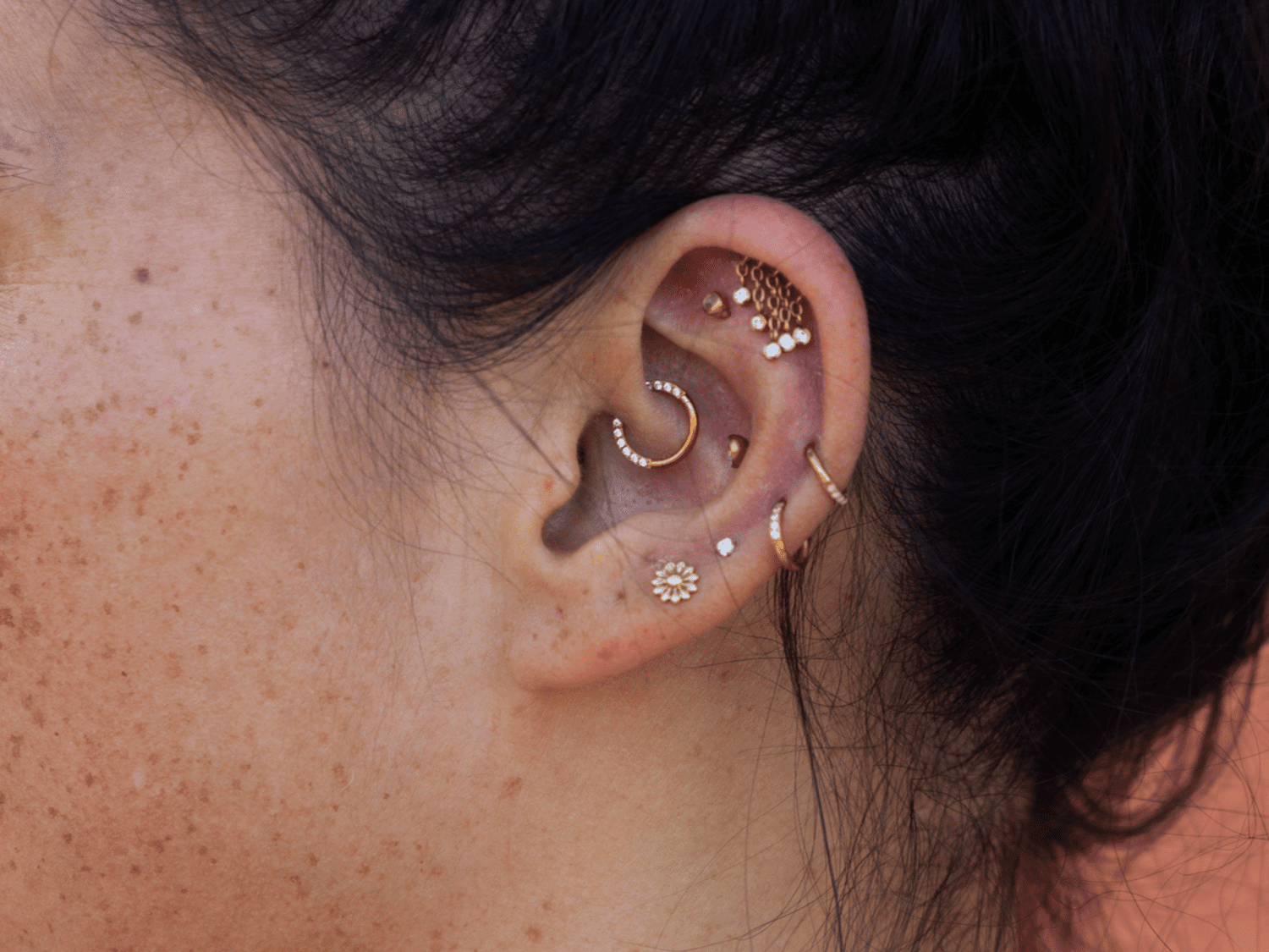 Gold piercing earring stack
